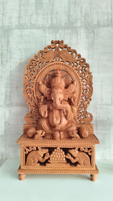 Grand Hand-Carved Wooden Ganesha Sculpture on Pedestal with Prabhavali and Mushaks